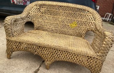 Wicker Bench . Well used, But has some life left.