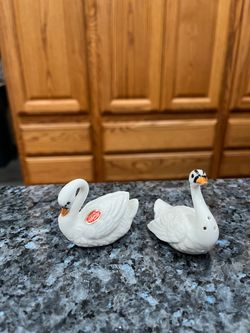 Vintage Pair of Small Bone China Swan Salt and Pepper Shakers. Preowned never used . The bottom Has some wear due to sitting on display in a cabinet f