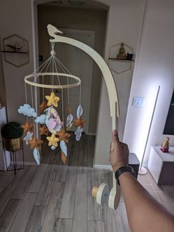 Crib mobile along with holder