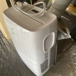 LG 6,000 BTU Portable Air Conditioner Cools 250 Sq. Ft. with Dehumidifier in White