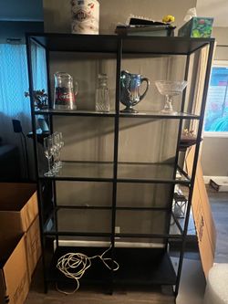 IKEA glass and metal shelves.