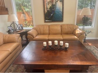 Caramel leather sofa and loveseat