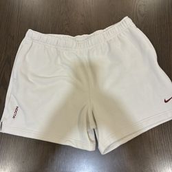 Beige Nike NOCTA shorts