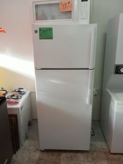 GE Refrigerator white excellent condition . Warranty . Delivery available . 2203 Fowler st. Ft. Myers 33901