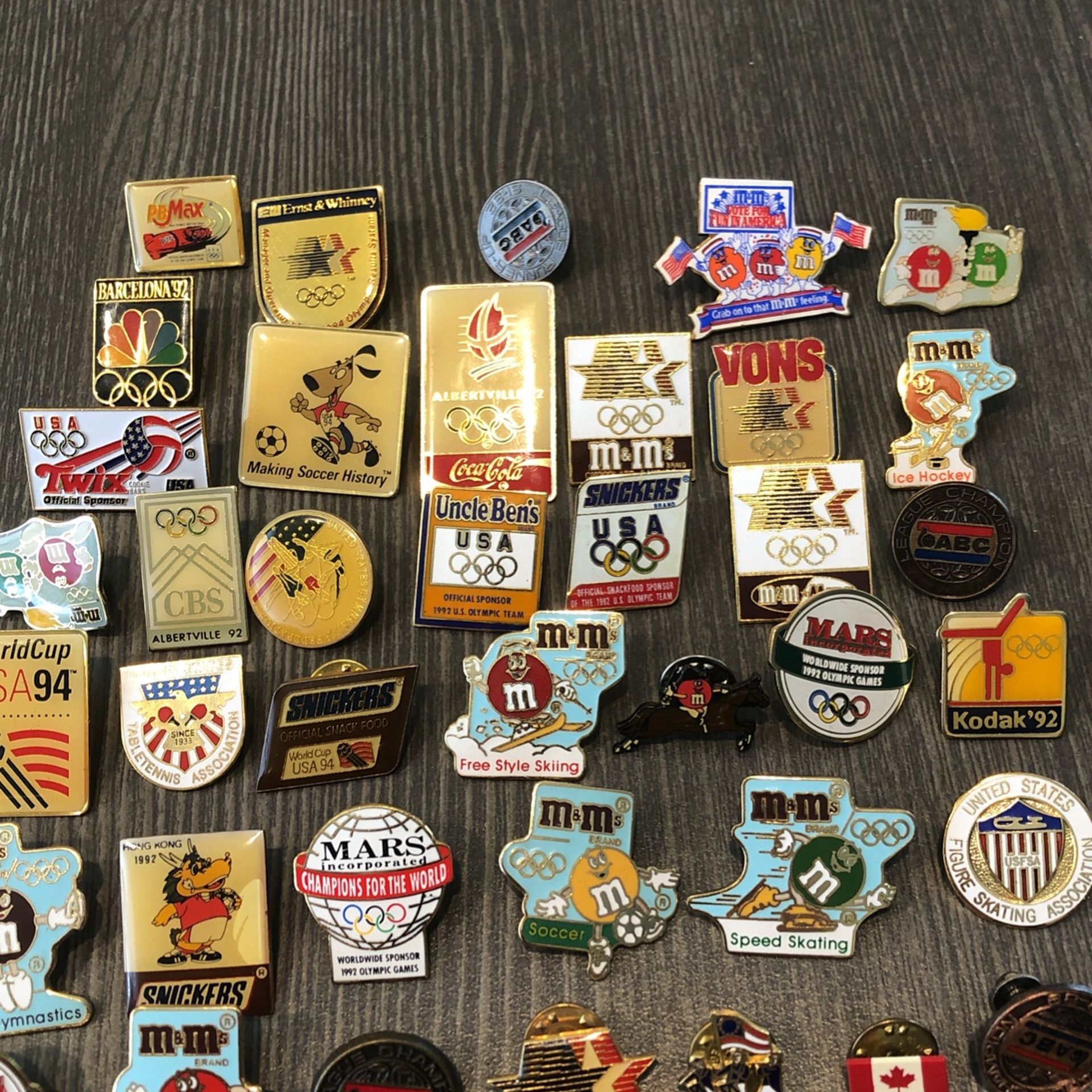 45 sponsored olympic metal collectors pins. Various sporting events of different years