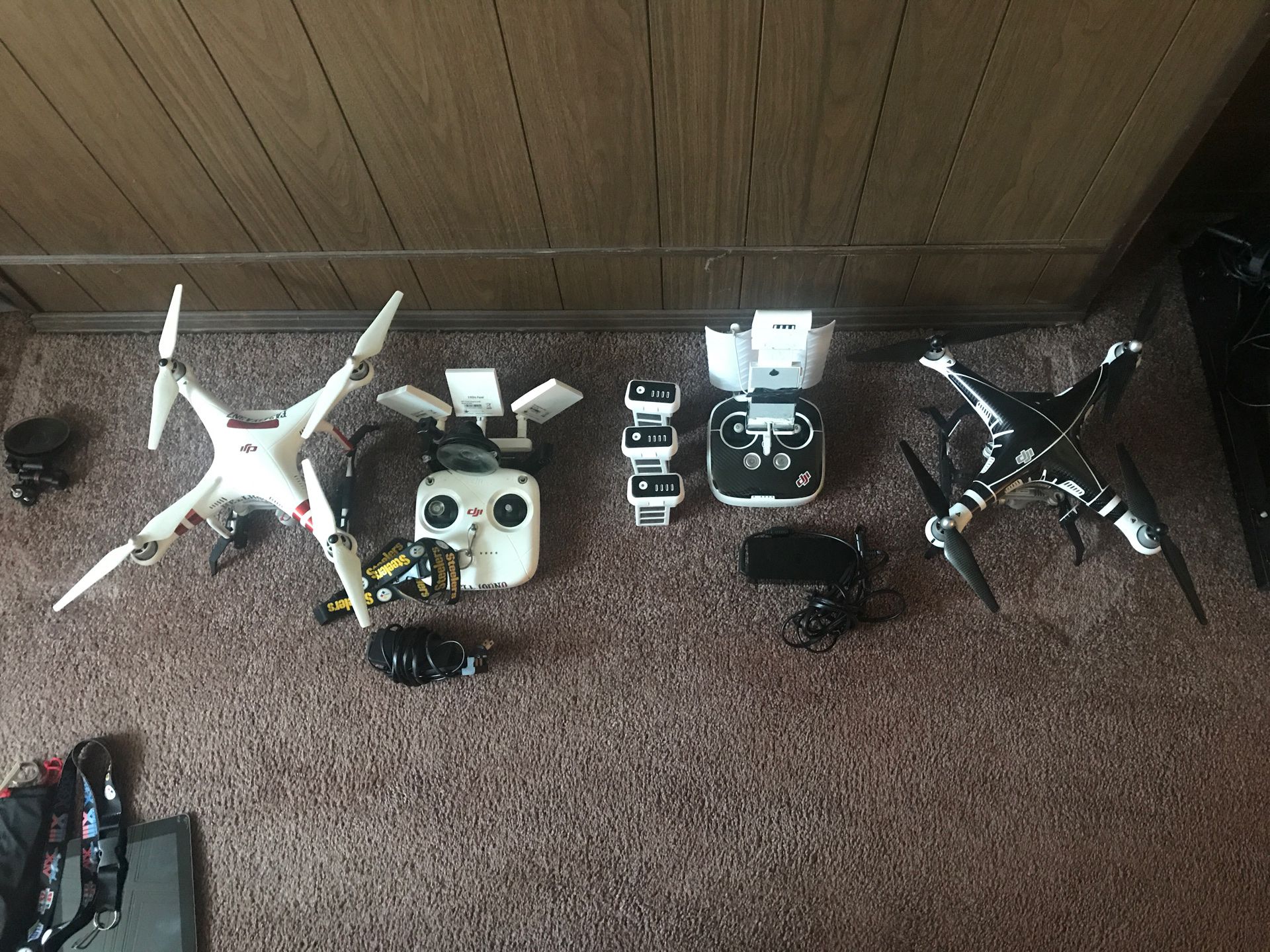 DJI PHANTOM 3 standard and PHANTOM 3 PRO 2 controllers 3 batteries 2 chargers and 3 more antennas for the standard not shown in photos