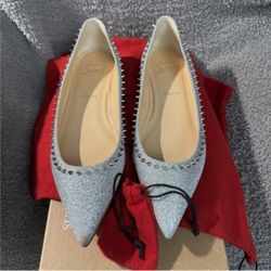 Christian Louboutin glitter spiked flats.