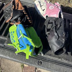 Child, baseball gloves, and batting helmets and balls