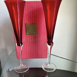A pair of Lenox Holiday gems, toasting flutes in Ruby, red