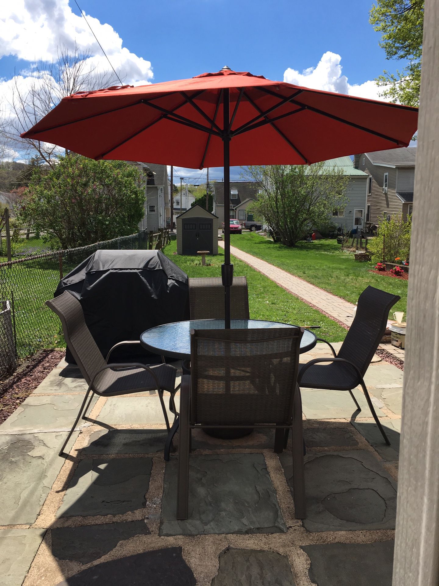 Outdoor Table. 4 Chairs. Umbrella with stand and cover. excellent condition. Umbrella is like new.