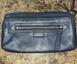 Navy blue Coach wristlet with silver hardware