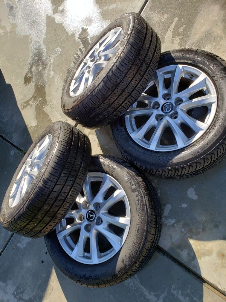 Mazda 3 rims and like new tires, Mazda wheels. Oem, 205/60/16, great condition, 5x114.3