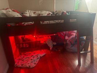 Brown wooden twin low loft bed