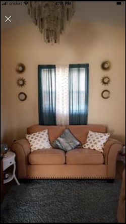 Couch & love seat with decorations