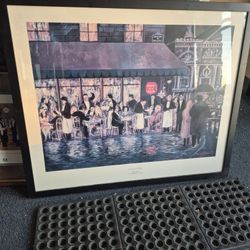 framed print of the artwork titled "Cafe de la Paix" by French-American artist Guy Buffet. 