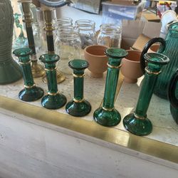 5 green glass candle sticks 