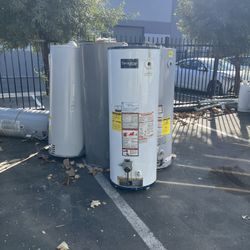 Old Water Heaters And Refrigerators 
