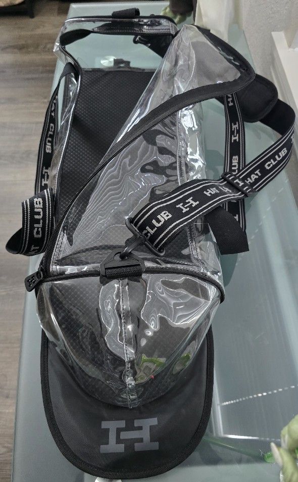 HAT CLUB DUFFLEBAG HOLDS 30 HATS! I HAVE 2 AT $15 A PIECE. USED BUT IN NEW CONDITION! ABLE TO HANG UP ON WALL!