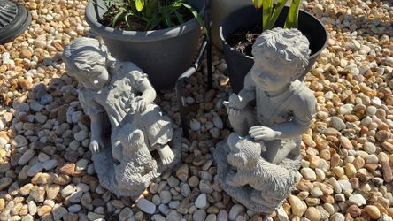 Pair boy and girl garden statues