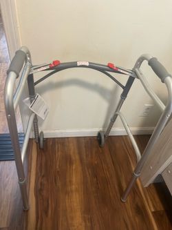 Drive Medical Deluxe Two-Button Folding Walker with 5" Wheels.