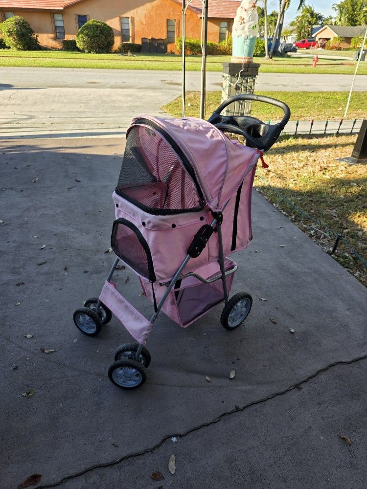 Pink pet Stroller foldable interior
Inside
23 L X 21 H X 13"W