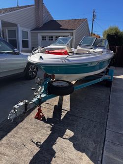 Teal and White Searay (1996)  Boat with Trailer