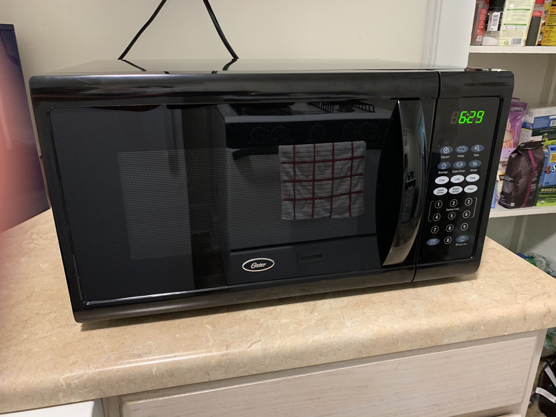 Oster 1.1 cu ft 1100W Digital Microwave Oven for Sale in Erie, PA OfferUp
