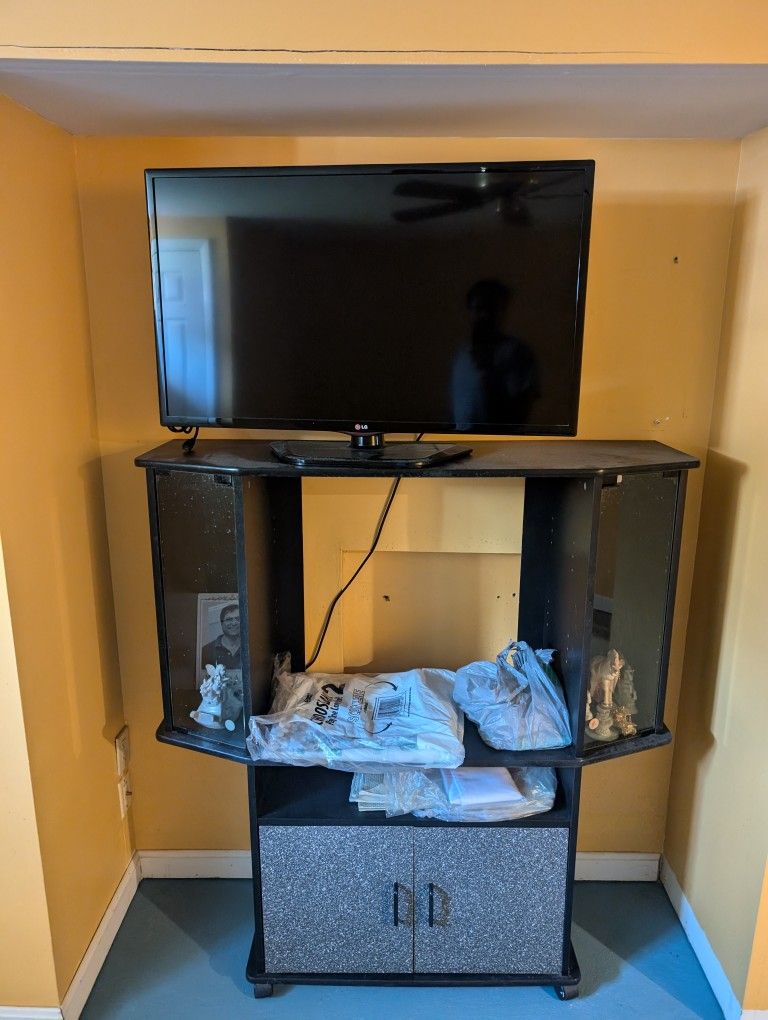 Lg 39-In HD TV and TV stand. No remote. Works with no issues.