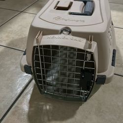 Petmate Kennel Cab, a hard-sided plastic pet carrier designed for travel. 