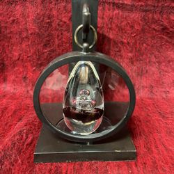 A  Decoration  Hanger With Magnifying Glass  and a Glass Stone . 