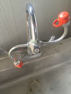 Sink with eye wash faucet