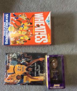Three items -Lakers 1987-88 back to back champion Wheaties box, 92 Laker calendar, 2005 Caron Butler bobble head