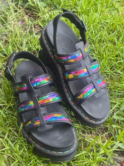 Vibrant Dr. Martens Yelena Sequin sandals in size US Women's 9 (UK 7, EU 41). These black leather platform sandals have three straps adorned with rain