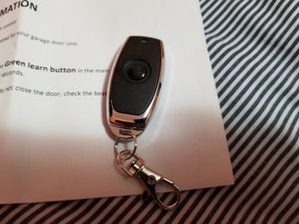 Craftsman garage door mini remote with green learn button with instructions