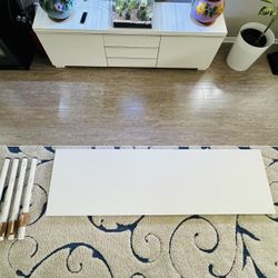 White tabletop with four legs included.