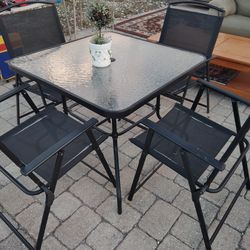 PATIO TABLE & 4 FOLDING CHAIRS