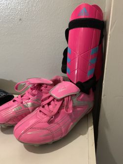 Girls soccer cleats and shin guards