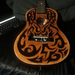 Hand painted first act mini classical guitar.
