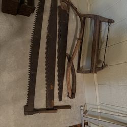 Antique Logging Saws And Scythe 