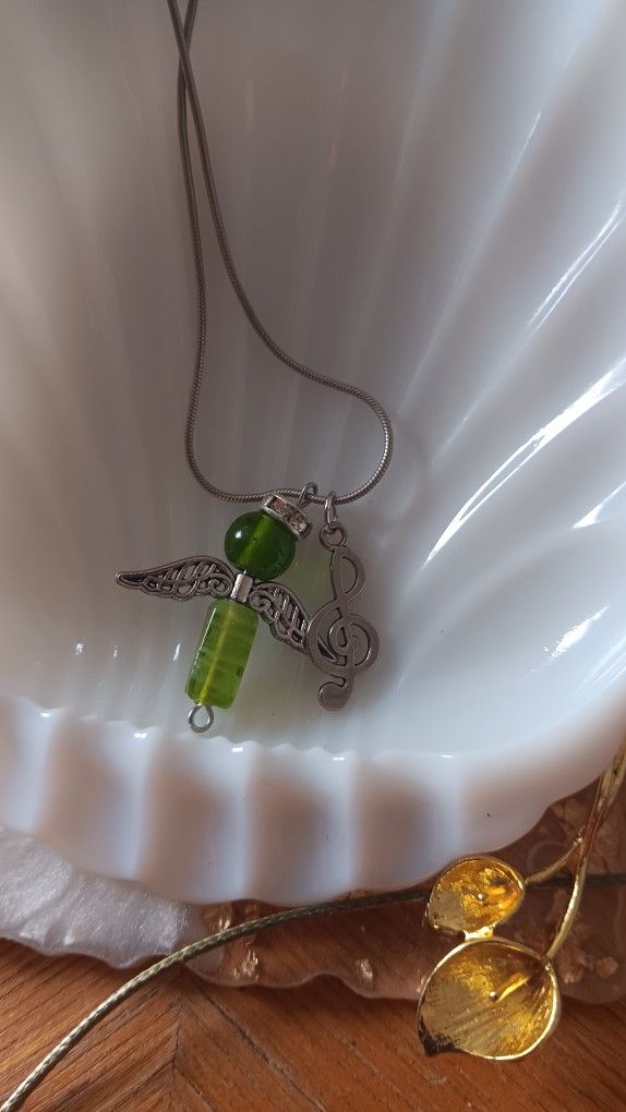 Green Angel With Music Symbol On A Silver Chain