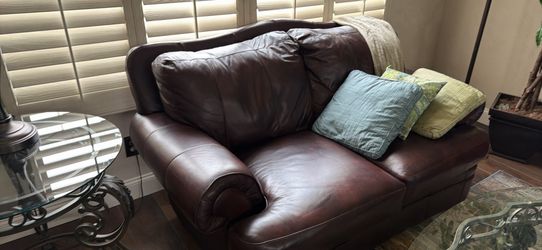 2 identical leather loveseats