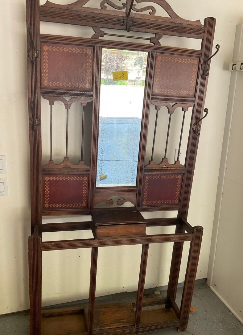 Antique wood hall cabinet with mirror, coat hooks, umbrella area and cubby for gloves