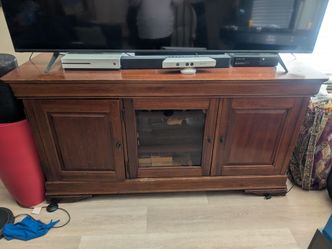 We're moving and can't take this wood TV cabinet with lots of built in game storage