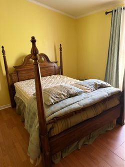Vintage Full-Size Four-Post Wooden Bed with mattress and box spring