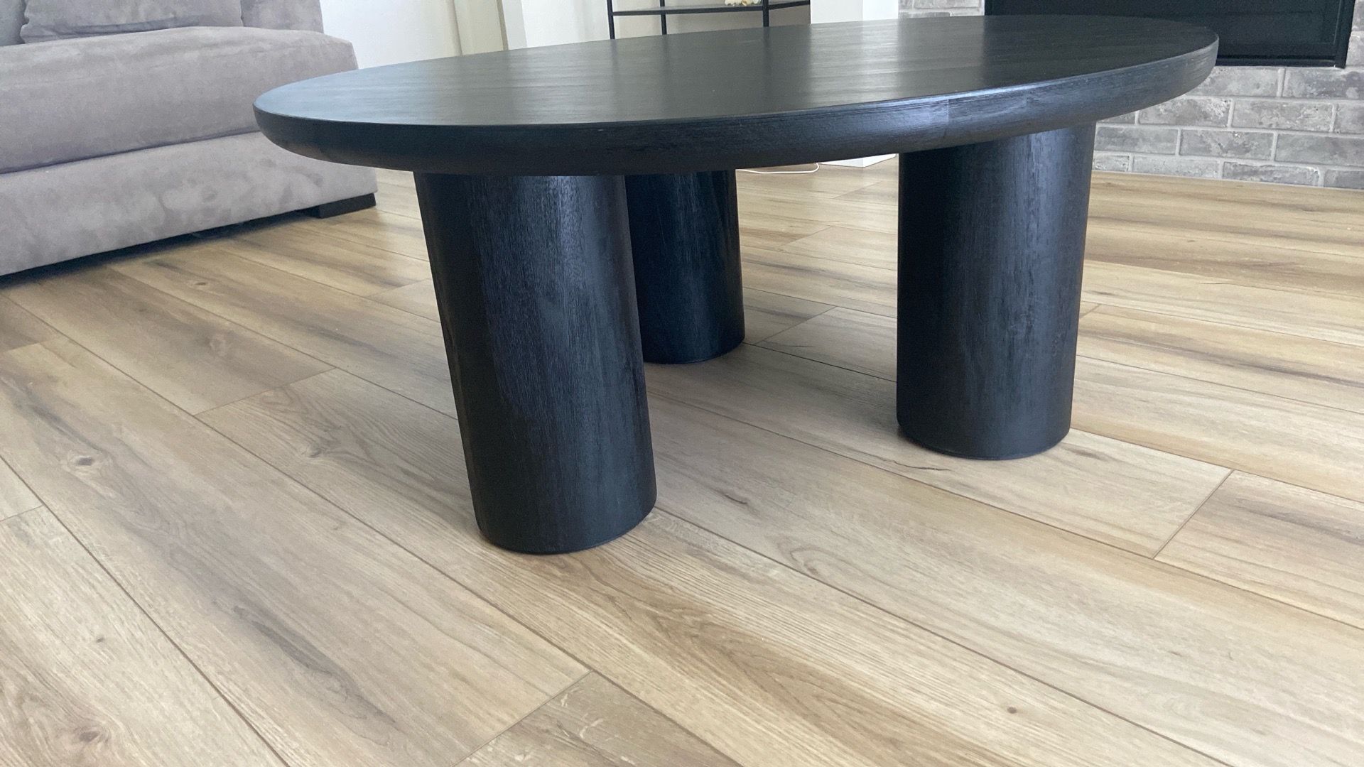 Round black wooden coffee table