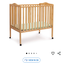 Delta foldable mini crib with mattress