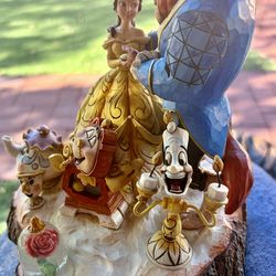 This is a Jim Shore Disney Traditions "Tale As Old As Time" Beauty and the Beast Carved by Heart Figurine