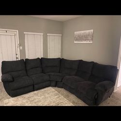 Dark Blue Couch With Recliners At The End