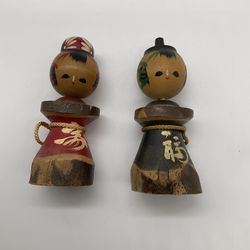 TWO VINTAGE HAND PAINTED KOKESHI DOLLS