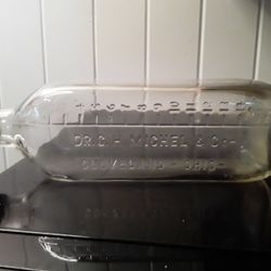 Vintage Dr. G.H. Michel & Co. 16 Oz. Embossed Clear Glass Bottle  from CLEVELAND OHIO 